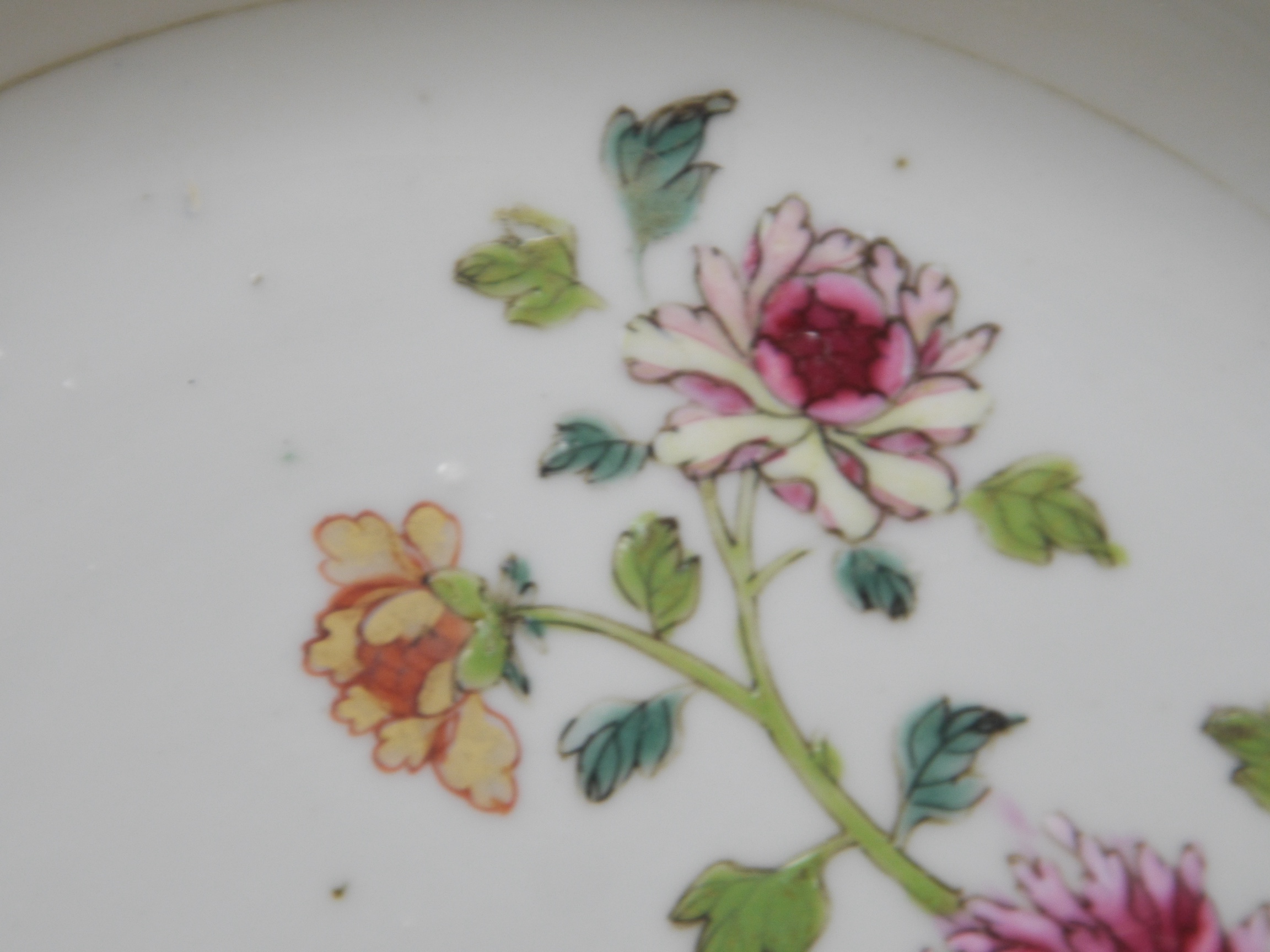 An 18th century Chinese 'double peacock' octagonal plate, 22cm diameter. Condition - some wear on the enamelling